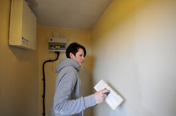 Karen hard at work painting a cupboard space in our new weighing room for the birds - 1st March 2012